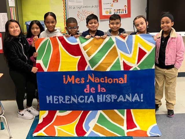 Students with sign