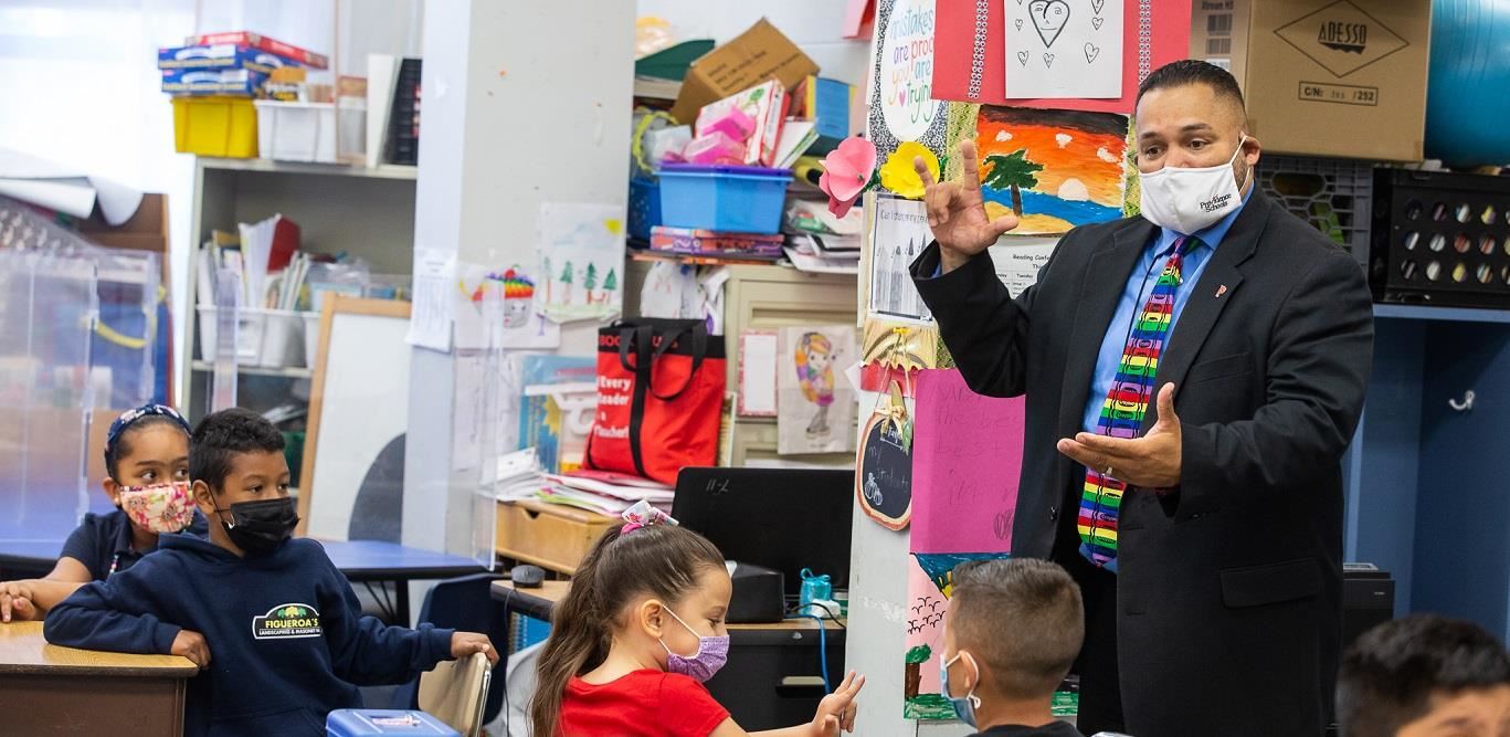 Montanez speaks with elementary students