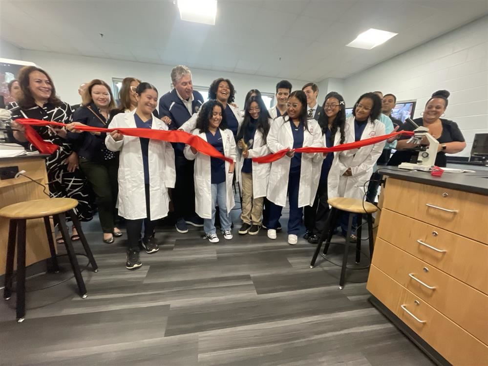  School Officials cut ribbon on a new science lab and open five new for redesign school models on th